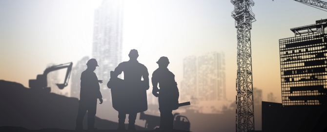 Silhouette engineer in a building site over Blurred construction site